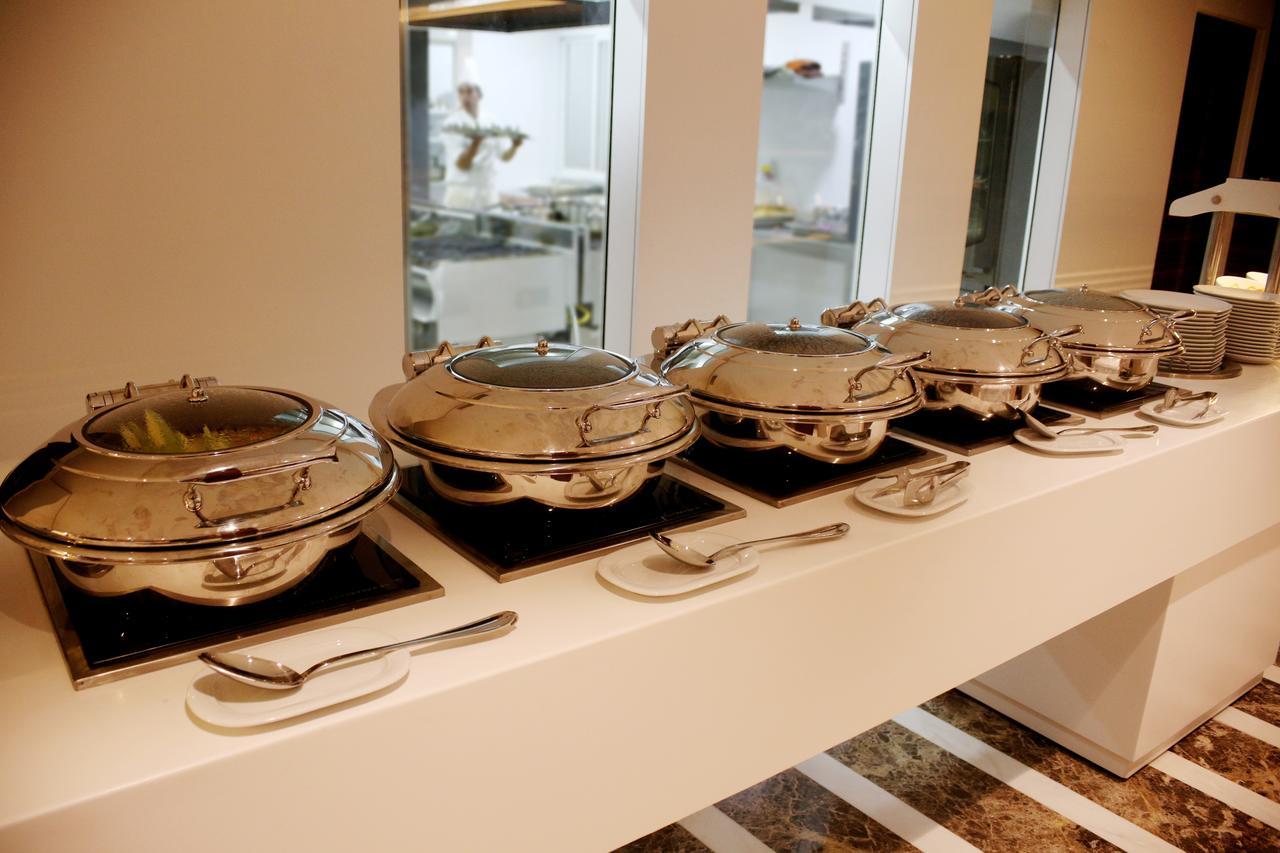 Radisson Hotel Sfax Exterior photo A row of chafing dishes